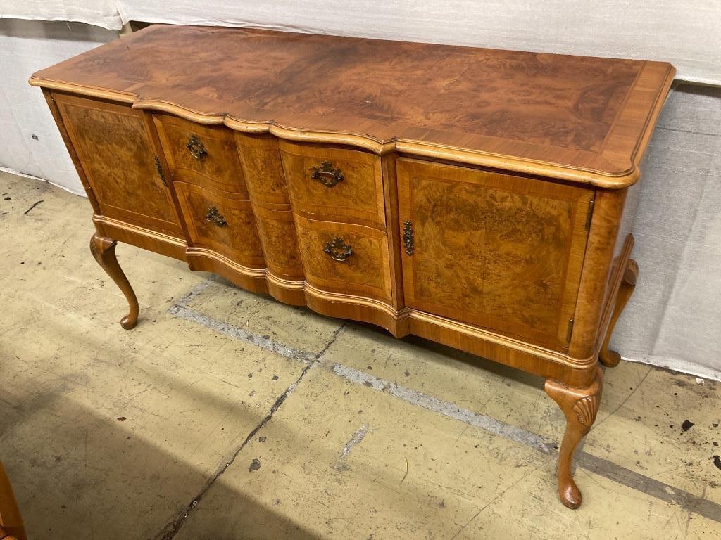 A Berwick Furniture Queen Anne Revival walnut dining suite, comprising a sideboard, an extending twin pillar dining table and six chairs, sideboard width 154cm depth 54cm height 90cm